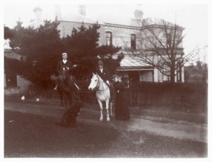 Syd and Harry Wragge on horseback at Yallambie with their sister Carrie leaning alongside, c1900.